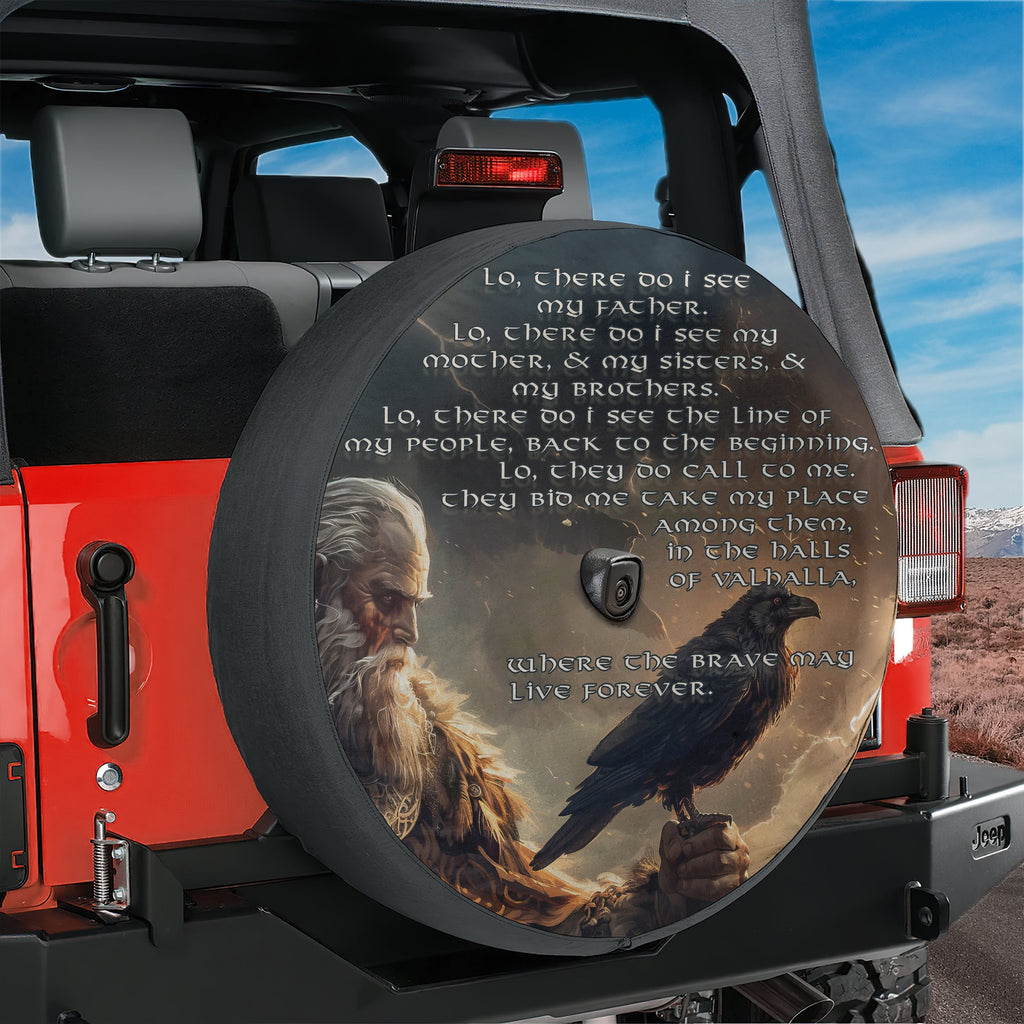 a large, round spare tire cover with a painting of a bearded man holding a bird on his hand. The cover also includes a quote about seeing one's family and friends, along with the phrase "Where the brave may live forever".