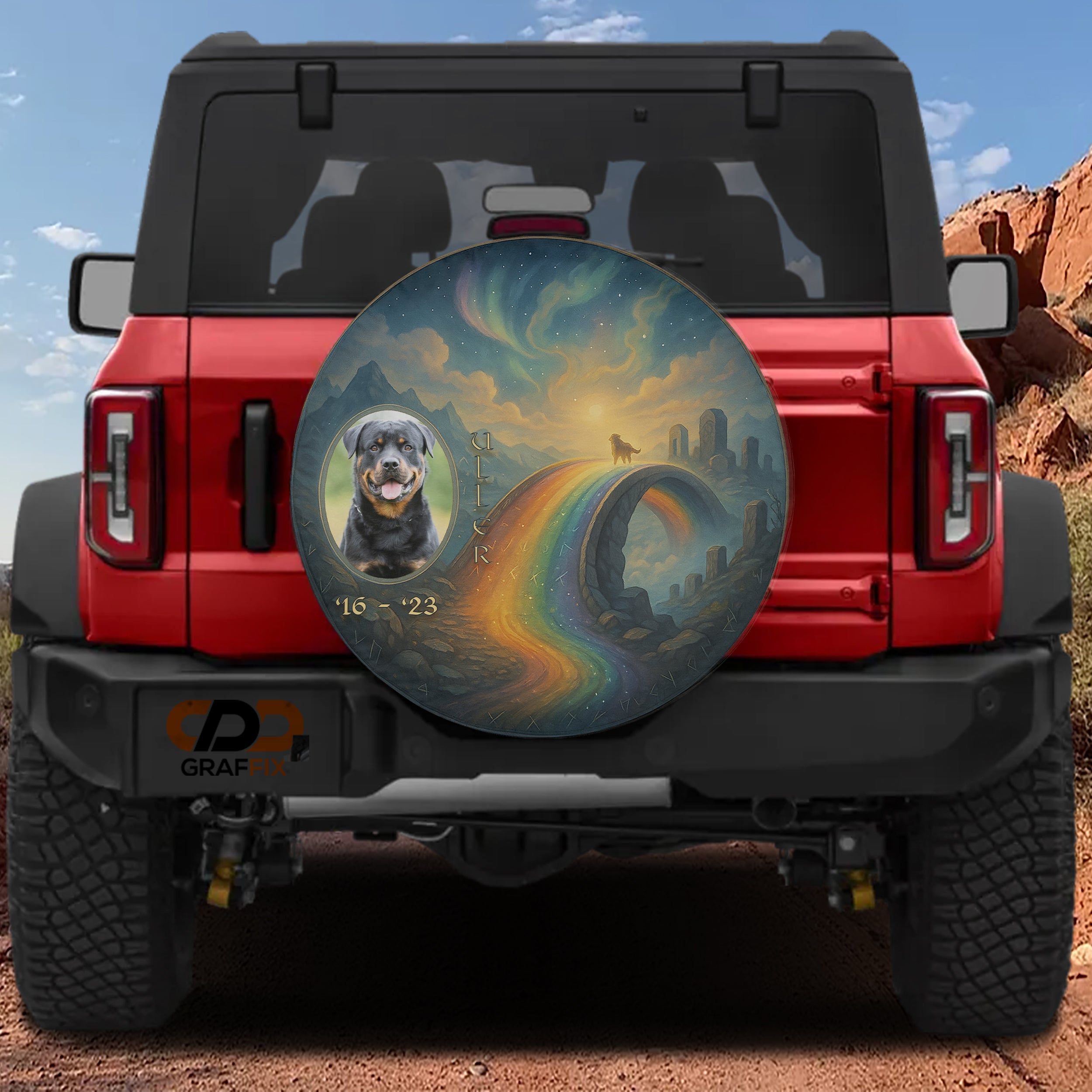 A red Jeep Wrangler with a large, colorful wheel cover featuring a painting of a dog and a rainbow.