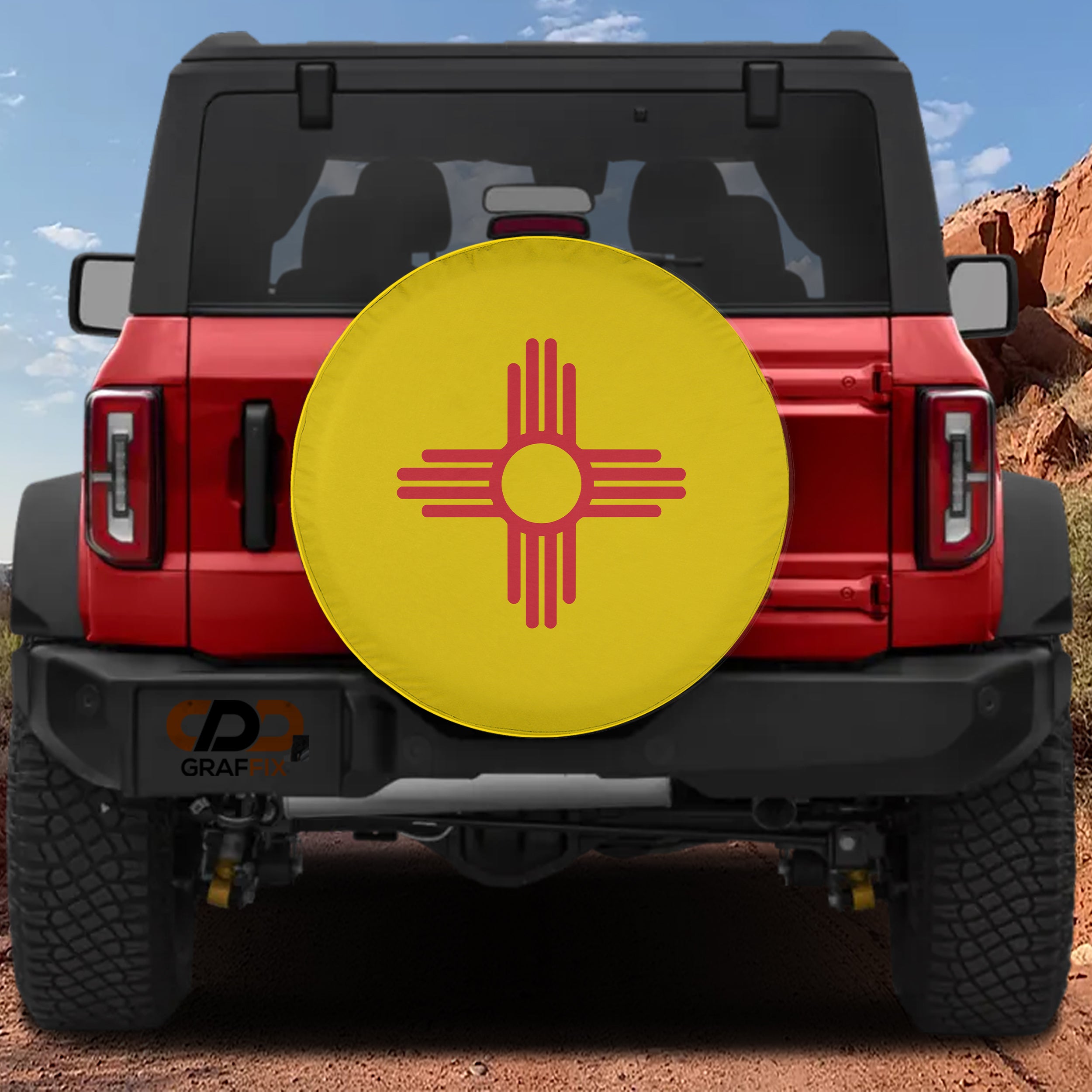 New Mexico State Flag spare tire cover round design with red Zia sun symbol on bright yellow field