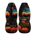 a pair of car seat covers with a vibrant autumn landscape design. The covers are adorned with a variety of pumpkins and trees, creating a colorful and festive scene.