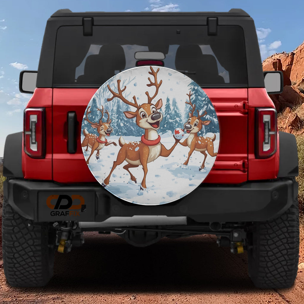 Reindeer Games spare tire cover mounted on a red Bronco rear with backup camera hole and prancing reindeer art