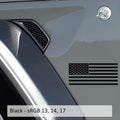 Black American flag fender decal applied to silver Jeep Wrangler JL near fuel door panel