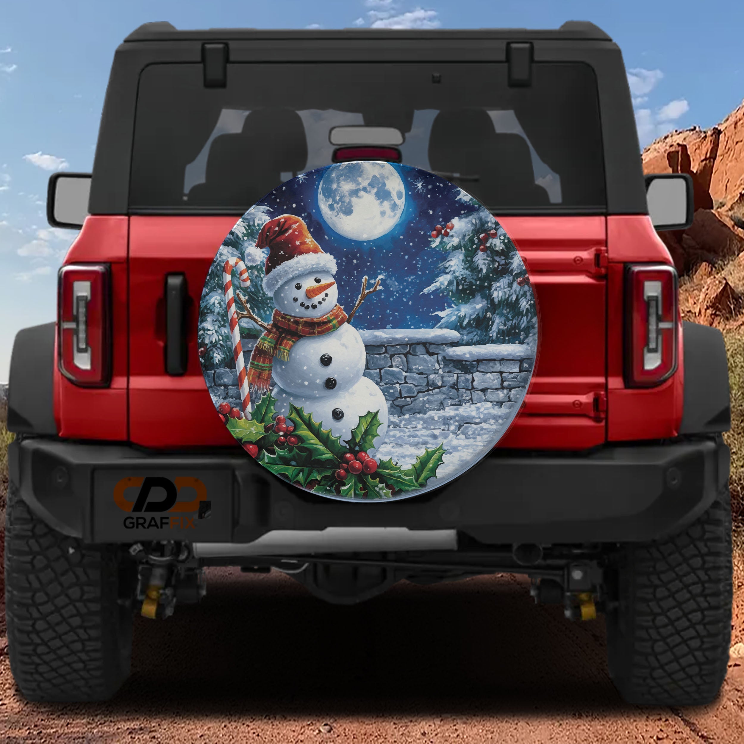 Frostys Midnight Cheer spare tire cover on red Bronco snowman red hat candy cane full moon scene