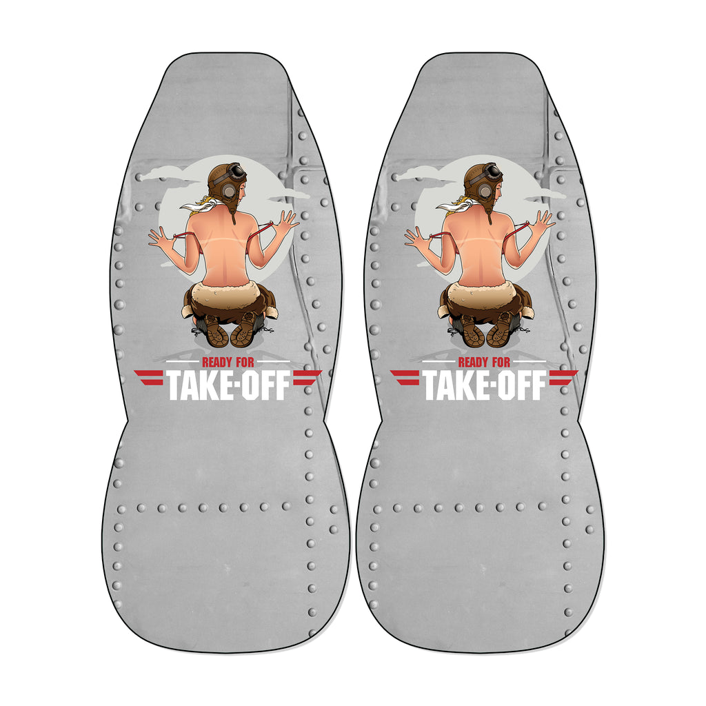 a pair of gray metal seat covers with a graphic design depicting a woman in a pilot's uniform. The text "READY FOR TAKE-OFF" is prominently displayed on the seat covers.