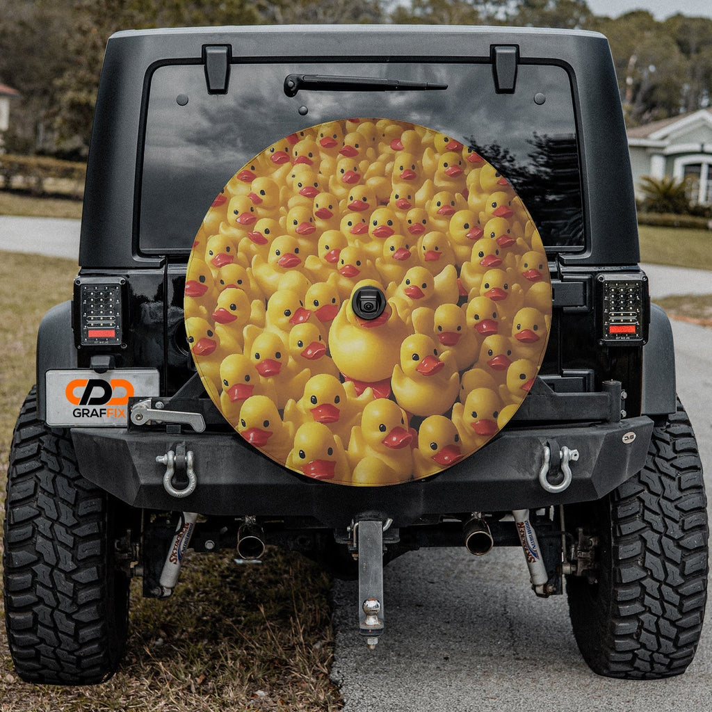 Rubber Duck Army spare tire cover on a black Jeep rear with massed yellow rubber ducks and central larger duck
