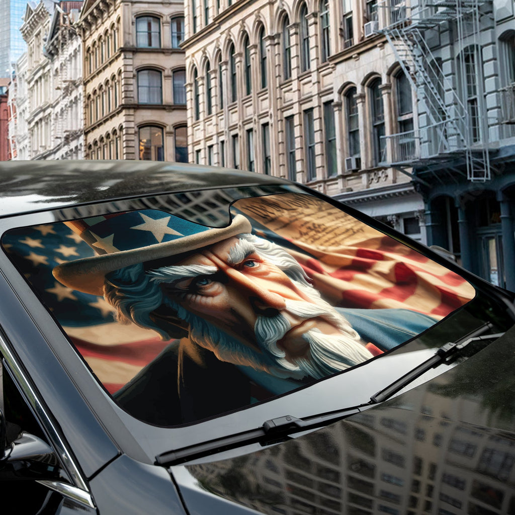 Uncle Sam We the People accordion sunshade close-up installed on a dark sedan windshield exterior detail