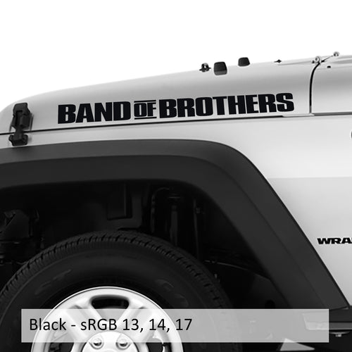 Pair of BAND OF BROTHERS side-hood lettering decals shown in matte black on a white Jeep Wrangler fender panel