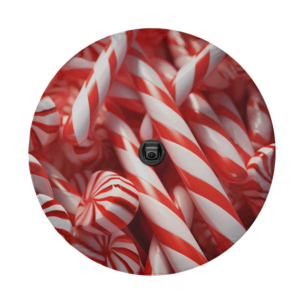 Round candy cane spare tire cover art with rear backup camera cutout opening at center mount