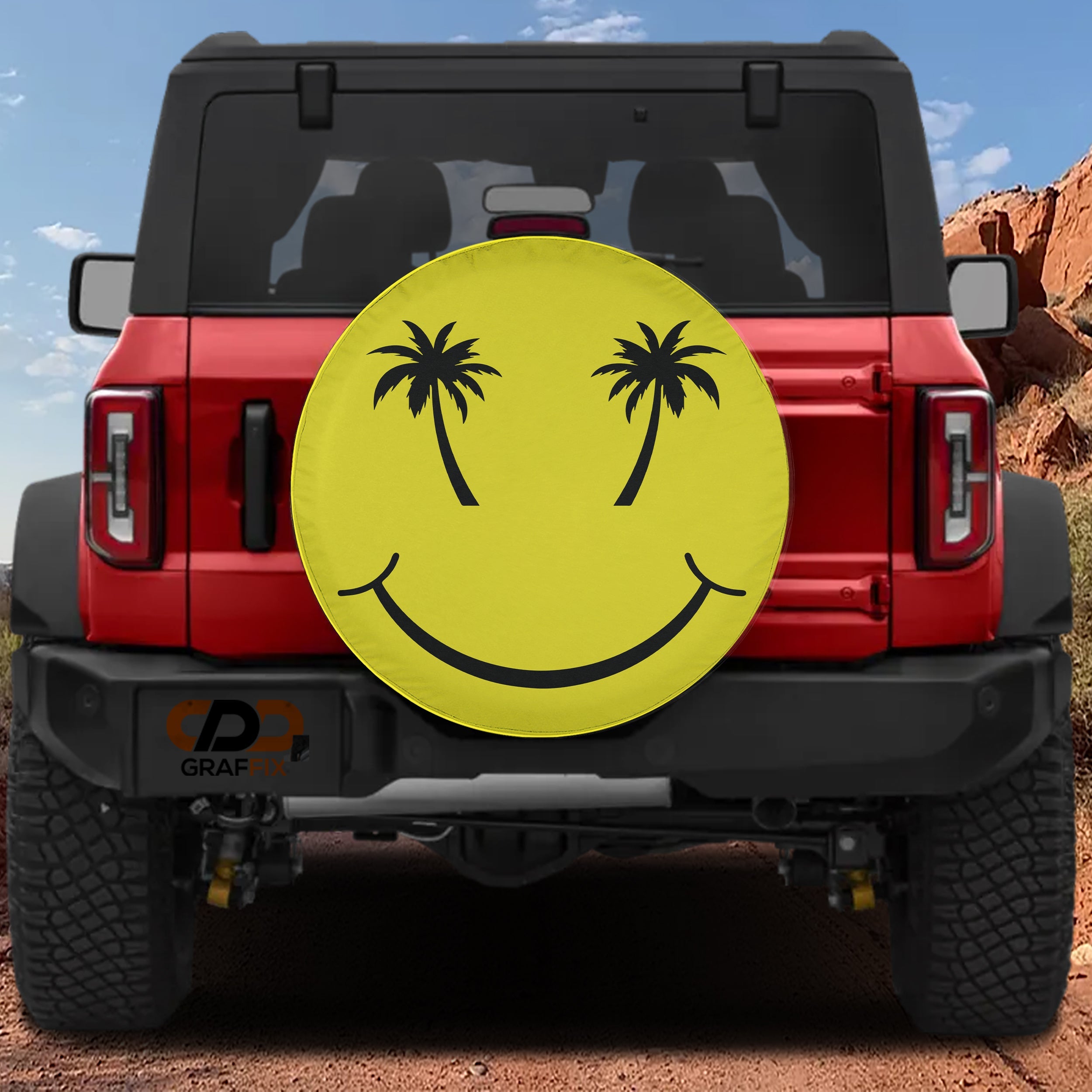 a red Jeep Wrangler with a large yellow smiley face decal on the rear window.