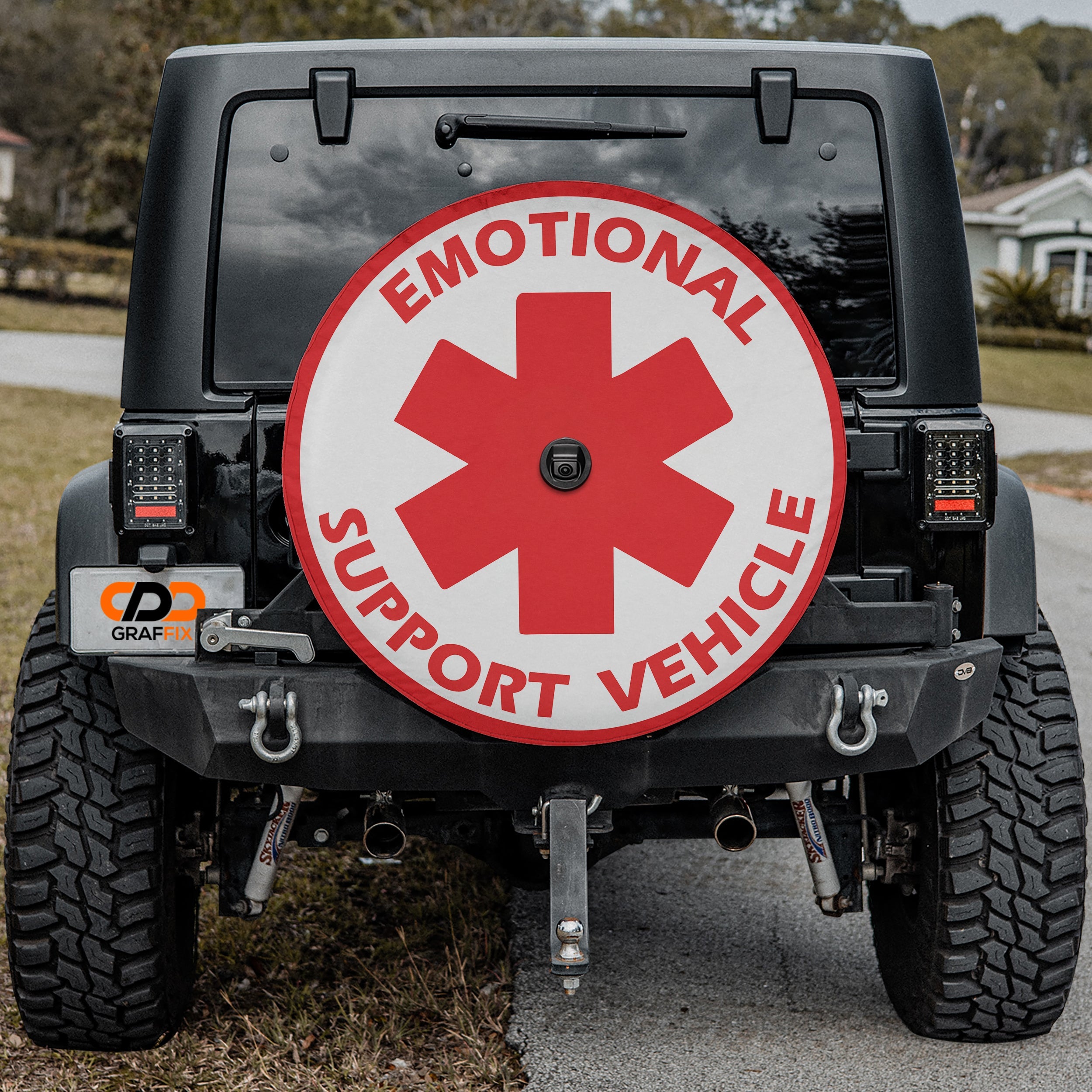 Emotional Support Vehicle spare tire cover with star of life emblem mounted on Jeep Wrangler