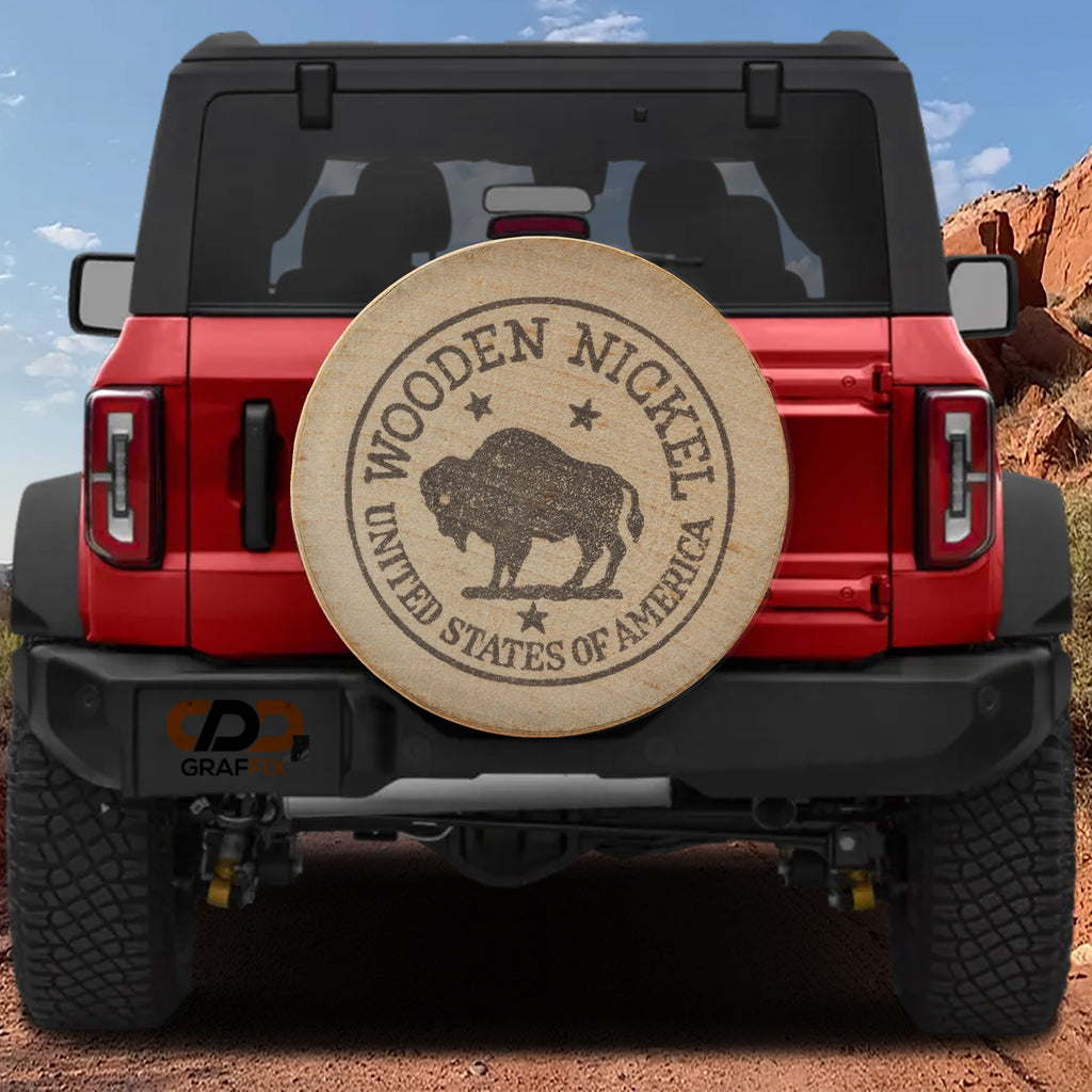 American buffalo wooden nickel spare tire cover on black Jeep Wrangler with wood grain coin