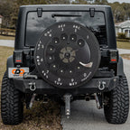 Vintage rotary phone dial spare tire cover on red Bronco rear with classic black dial graphic