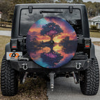 Dreamscape Tree spare tire cover installed on black Jeep Wrangler with GRAFFIX license plate
