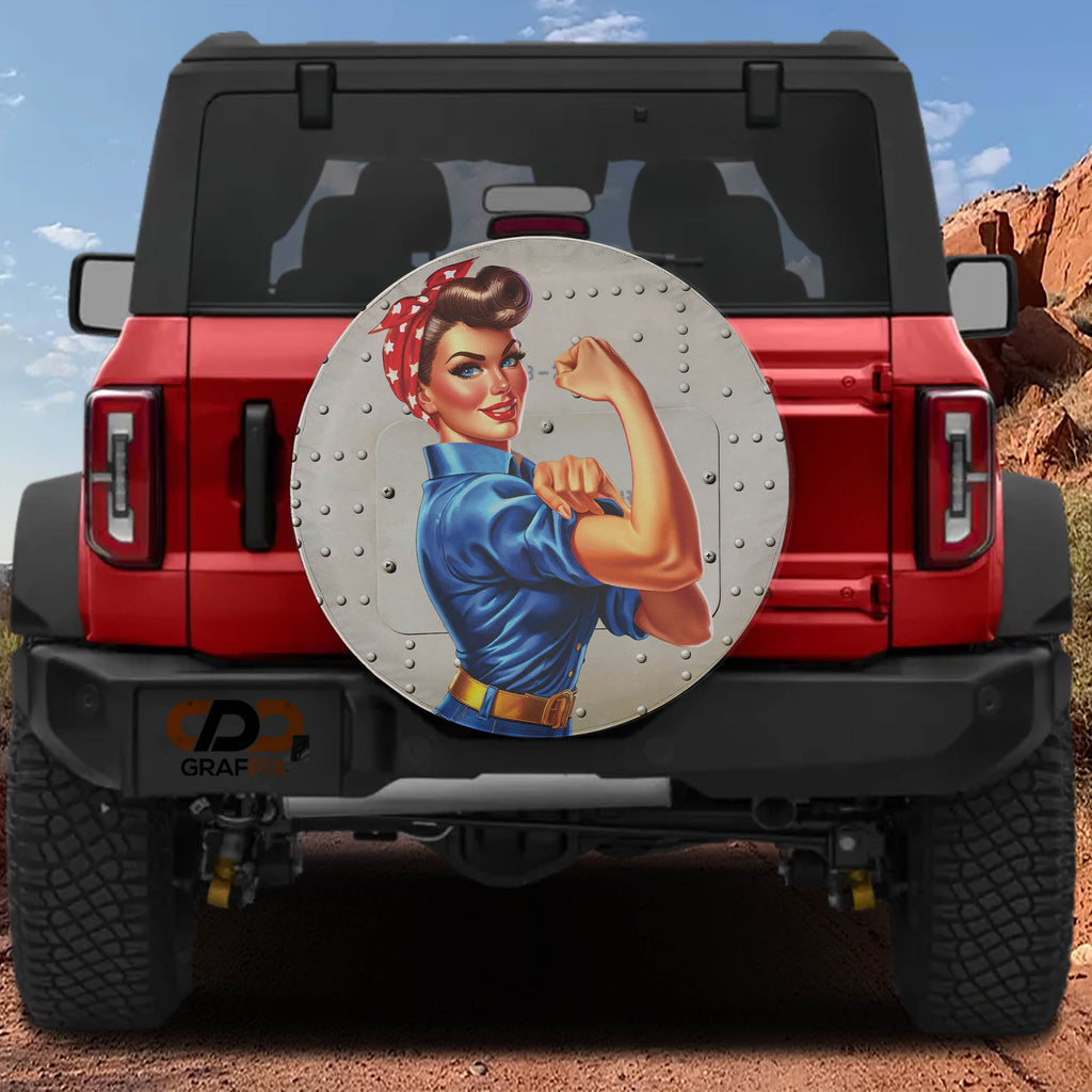 War Effort Woman Power-Up spare tire cover on a red Jeep Wrangler featuring riveted Rosie art