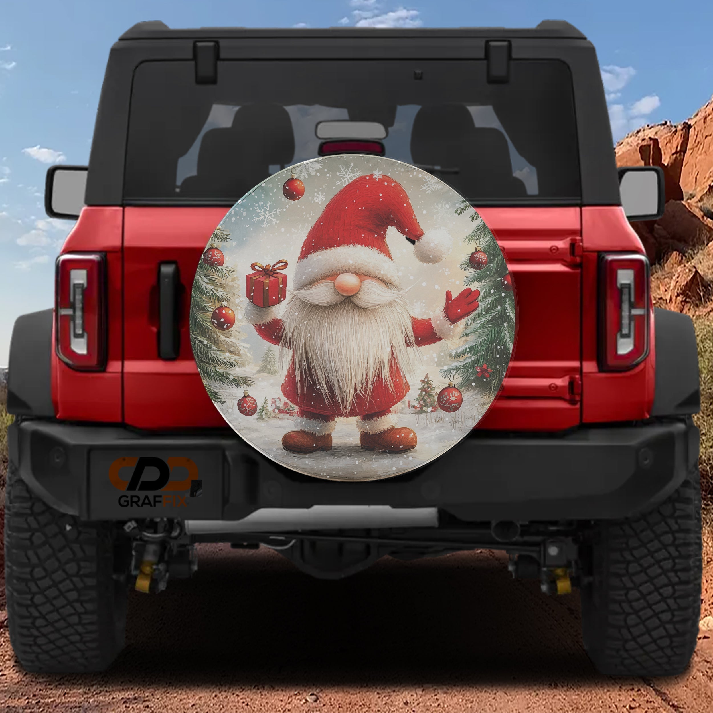 Christmas gift giving gnome spare tire cover mounted on red Bronco with red hat snowflake design