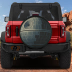 That's No Moon spare tire cover on black Jeep rear with gray Death Star superlaser dish