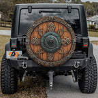 Viking Celtic shield spare tire cover installed on rear of Jeep vehicle