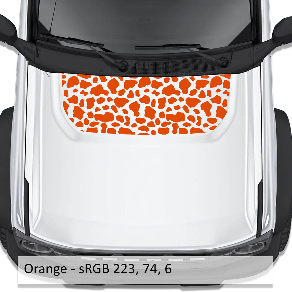 Cow Print blackout hood vinyl decal in orange shown installed on the hood of a 2021+ Ford Bronco