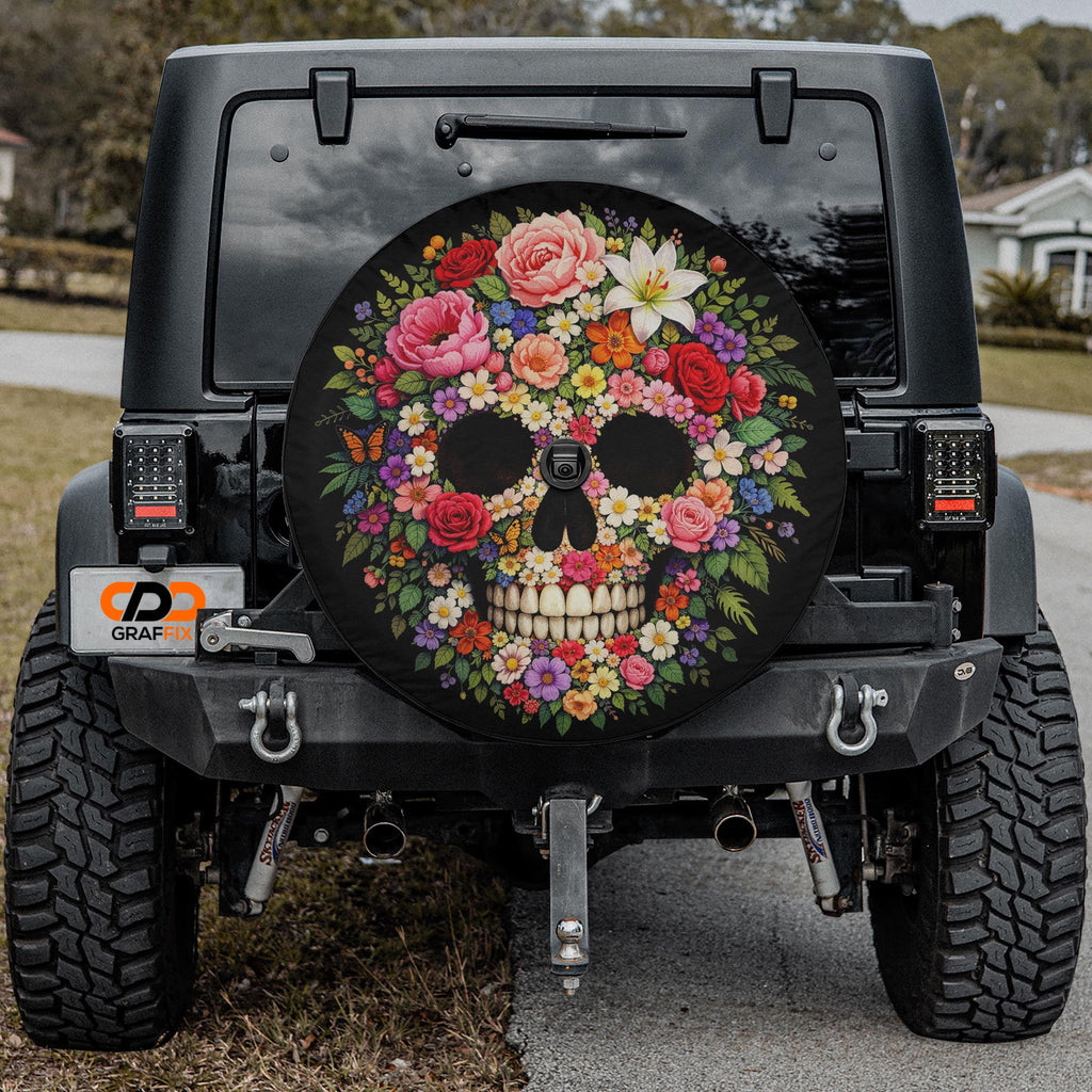 a black Jeep Wrangler with a colorful skull-shaped spare tire cover on the rear of the vehicle.