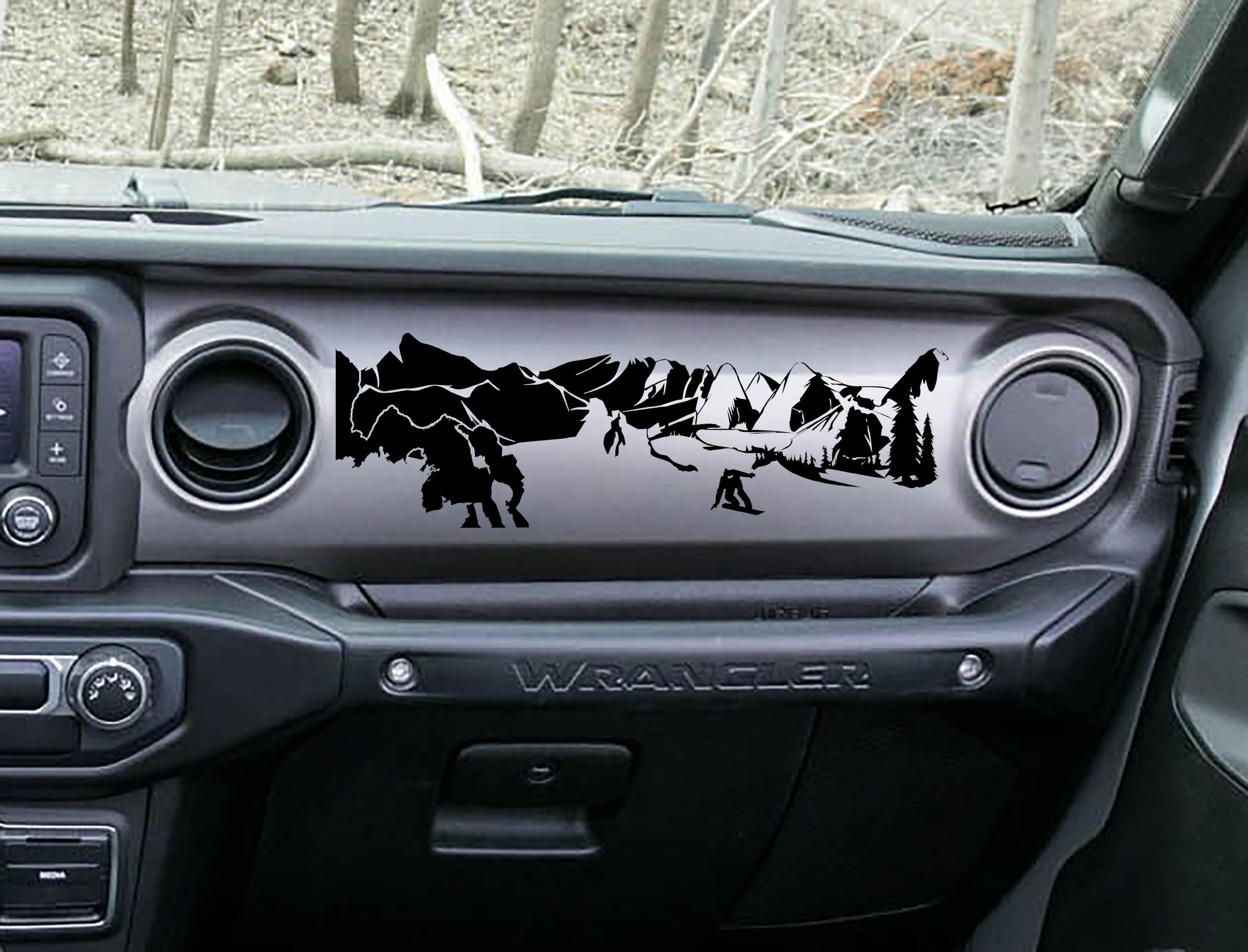 Black snowboarder mountain dashboard decal on Jeep JL Wrangler, snowboarder peaks pines artwork