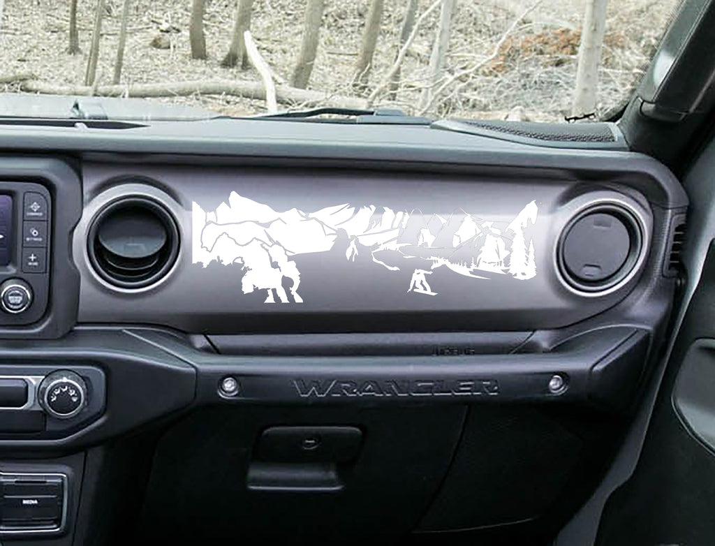 White snowboarder mountain dashboard decal on Jeep JL Wrangler, snowboarder peaks pines artwork
