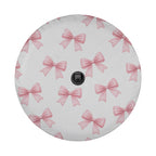 a circular object with a repeating pattern of pink bows on a white background.