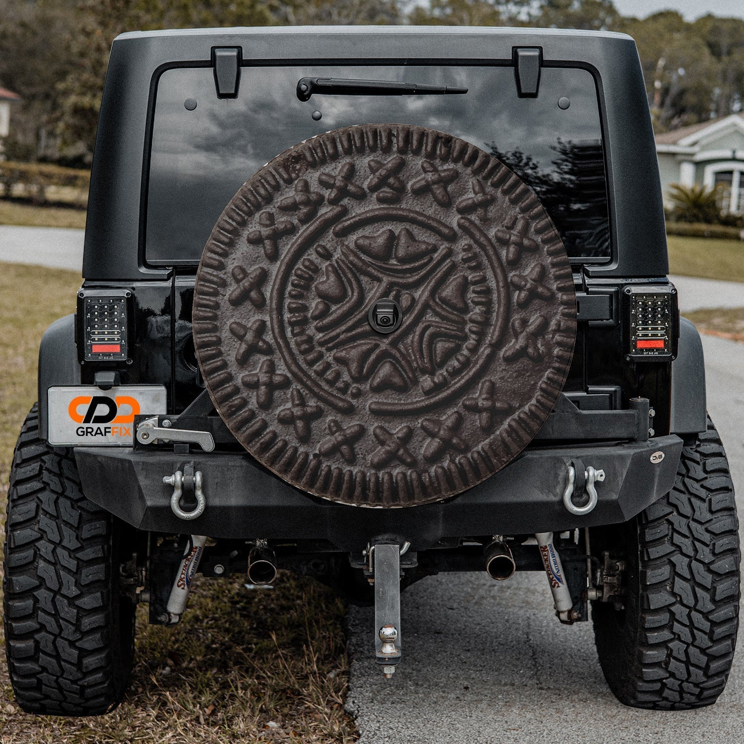 Choco Creme Cookie spare tire cover on a Jeep rear wheel with the playful sandwich cookie design centered on canvas