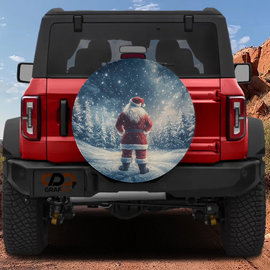 Santa's Silent Night spare tire cover on a red Jeep Wrangler depicting Santa under starry sky