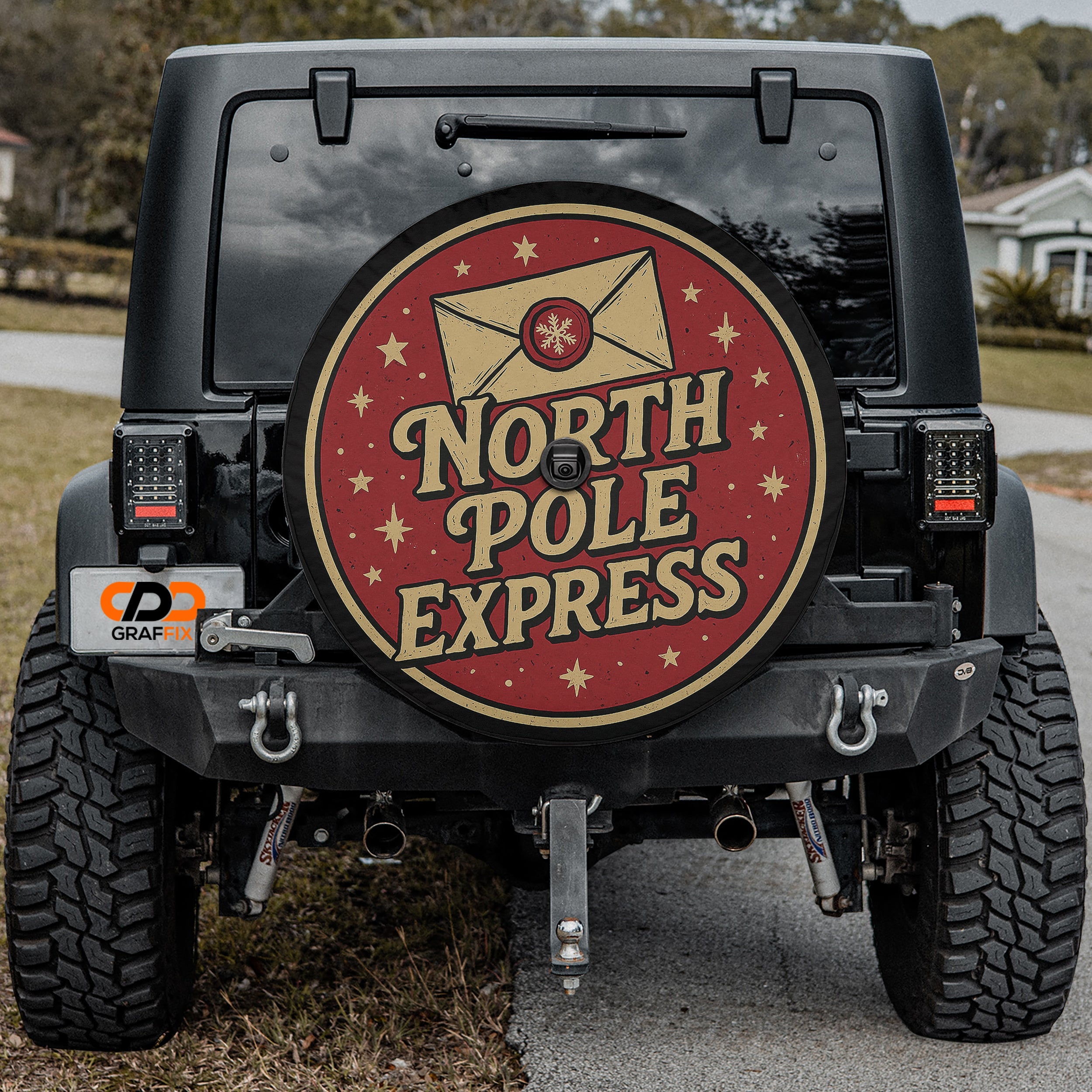 the back of a black jeep with a large, festive-looking round decal on the rear window that says "NORTH P Pole EXPRESS".