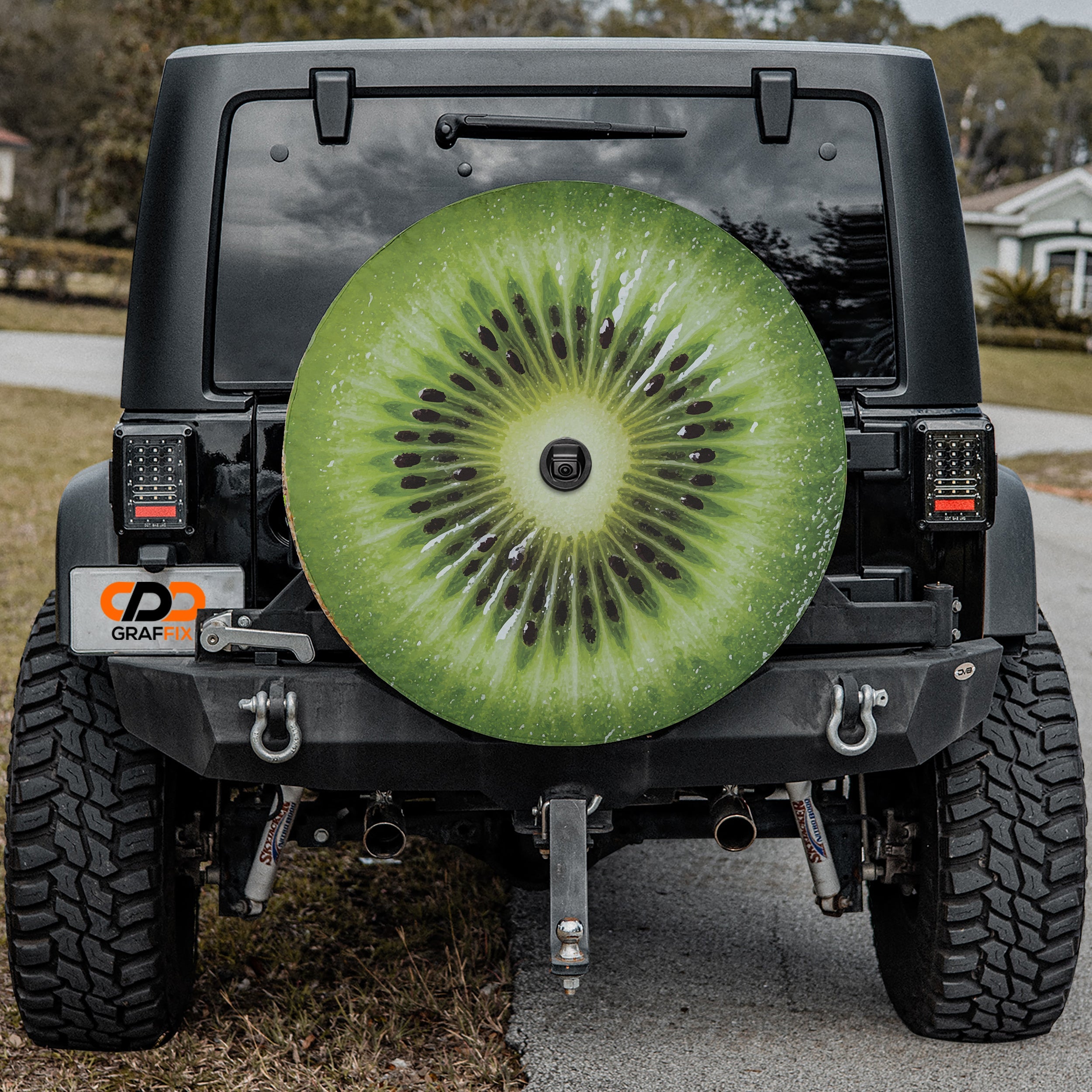 Kiwi fruit spare tire cover with green sliced kiwifruit graphic and seeded center design