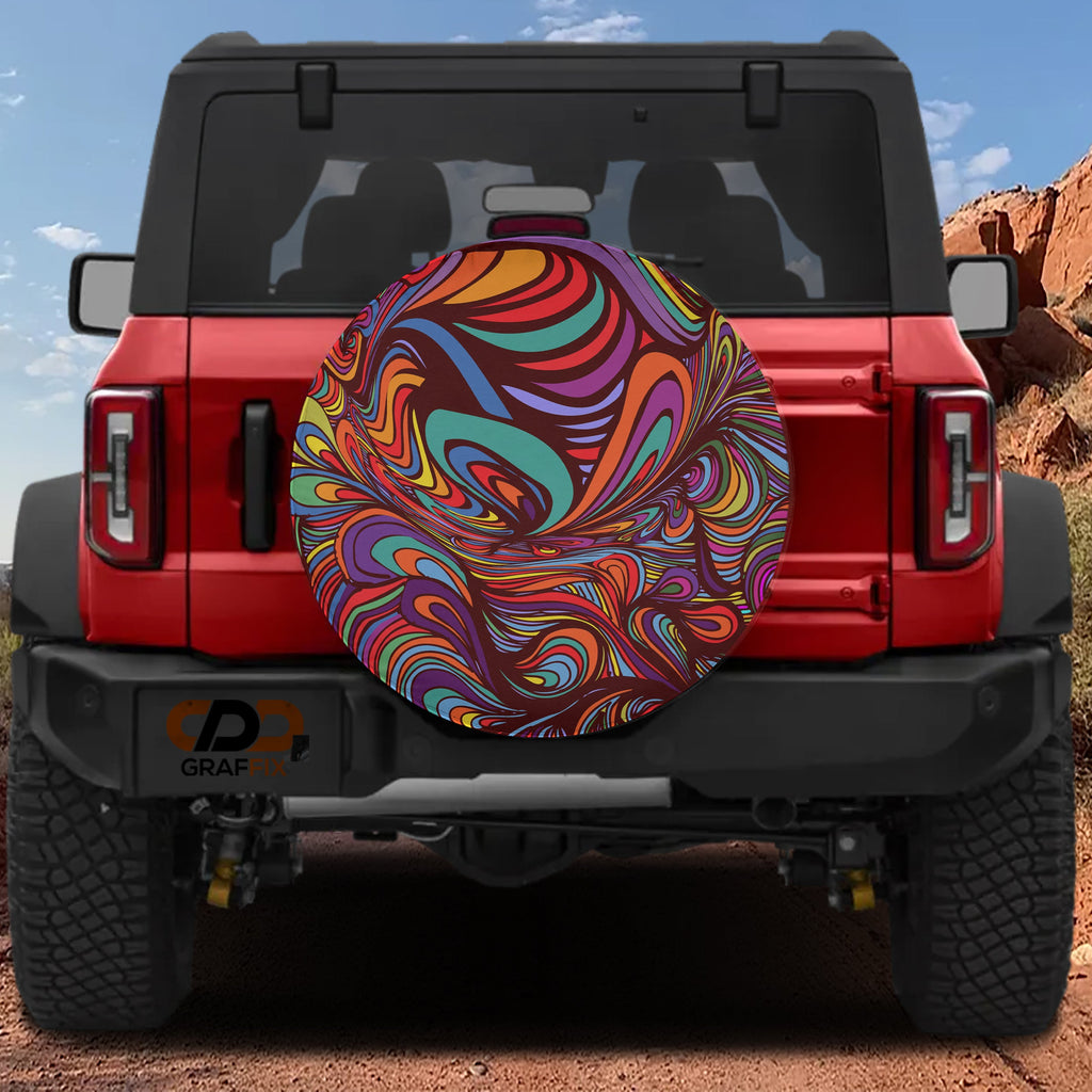 Rainbow psychedelic tire cover standalone product render showing bright orange teal purple swirl design