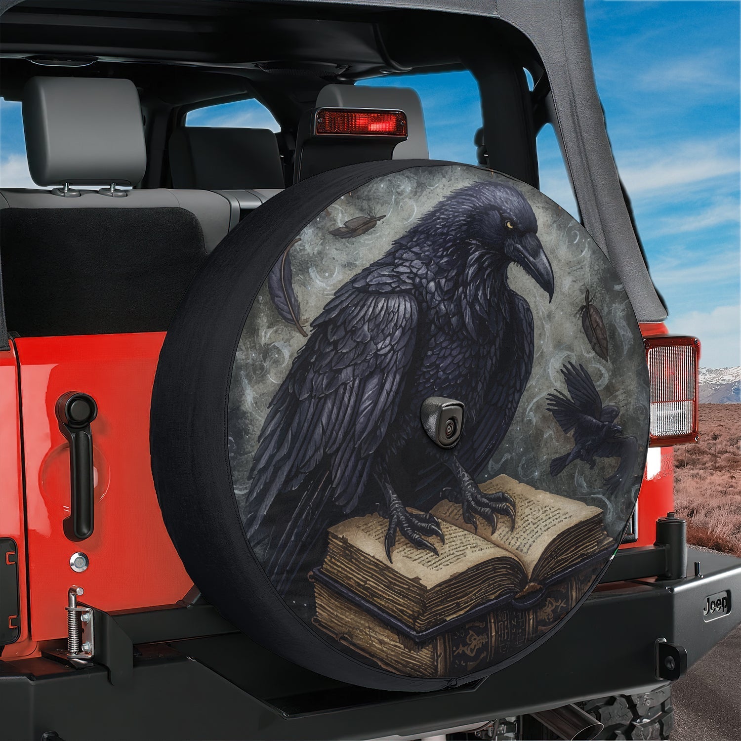 Huginn's Black Raven Tome spare tire cover mounted on red Jeep rear with mystic spell book and Norse raven art