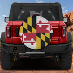 Maryland state flag spare tire cover mounted on red Ford Bronco rear with red rock canyon scenery
