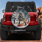 Penguin Present Parade spare tire cover mounted on a red Bronco rear featuring cheerful penguins holiday scene