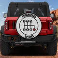 Endangered Species gear shift pattern spare tire cover mounted on red Ford Bronco SUV rear