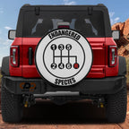 Endangered Species gear shift pattern spare tire cover mounted on red Ford Bronco SUV rear