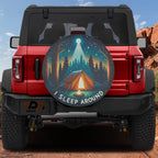 I Sleep Around Camping tire cover on a red Ford Bronco showing tent campfire pines moonbeam camping scene
