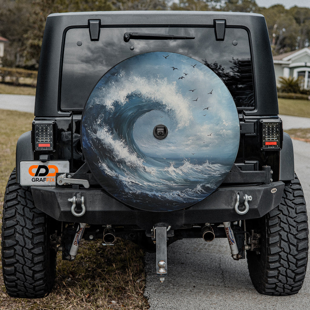 Tidal Wave spare tire cover on a black Jeep Wrangler rear hatch with painted curling ocean wave and seabirds