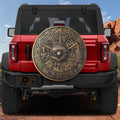 Shield of Achilles spare tire cover mounted on a red Bronco rear, bronze relief with mythic scenes and ocean