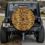 Close-up Bengal tiger print spare tire cover disc showing detailed orange and black stripe fur pattern texture