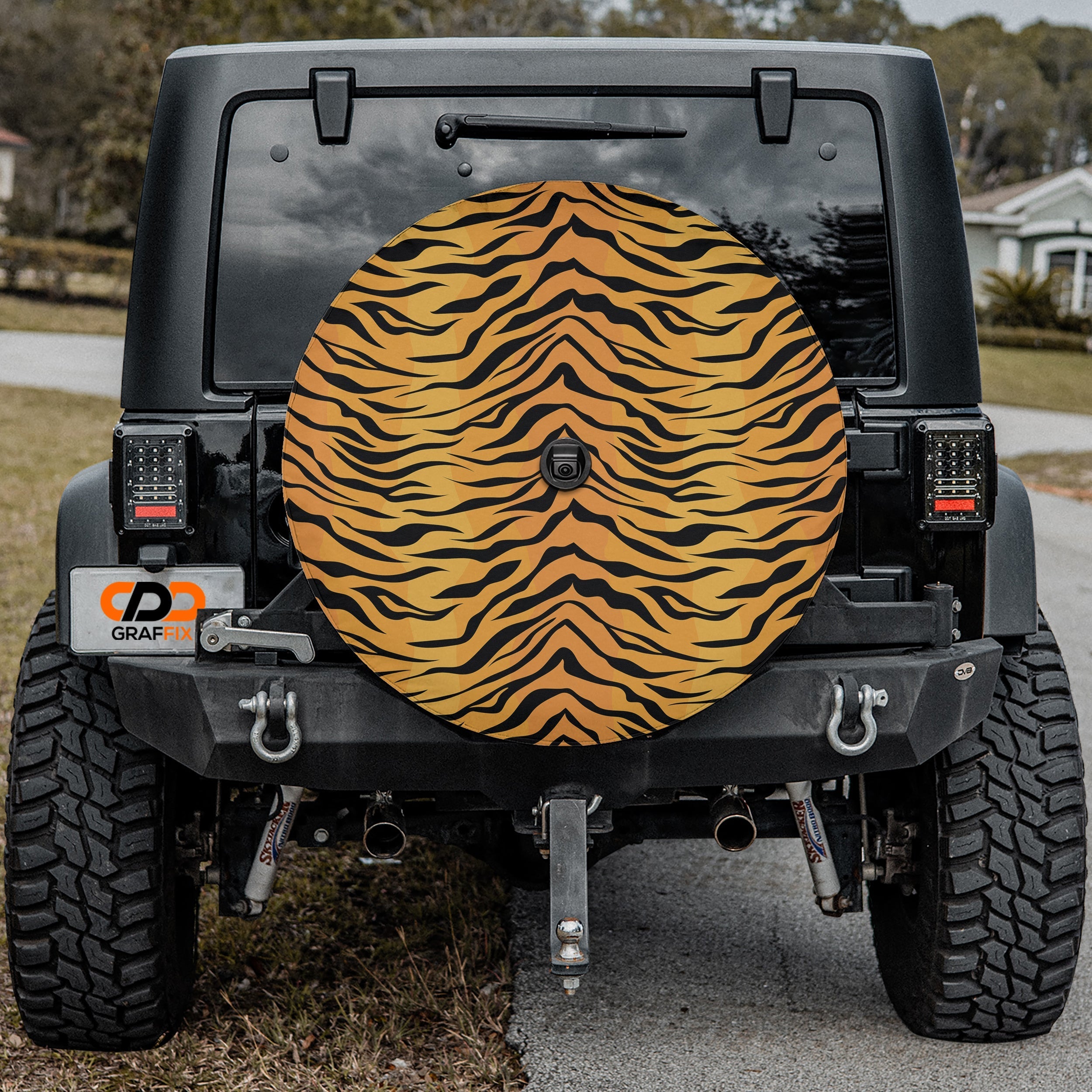 Close-up Bengal tiger print spare tire cover disc showing detailed orange and black stripe fur pattern texture