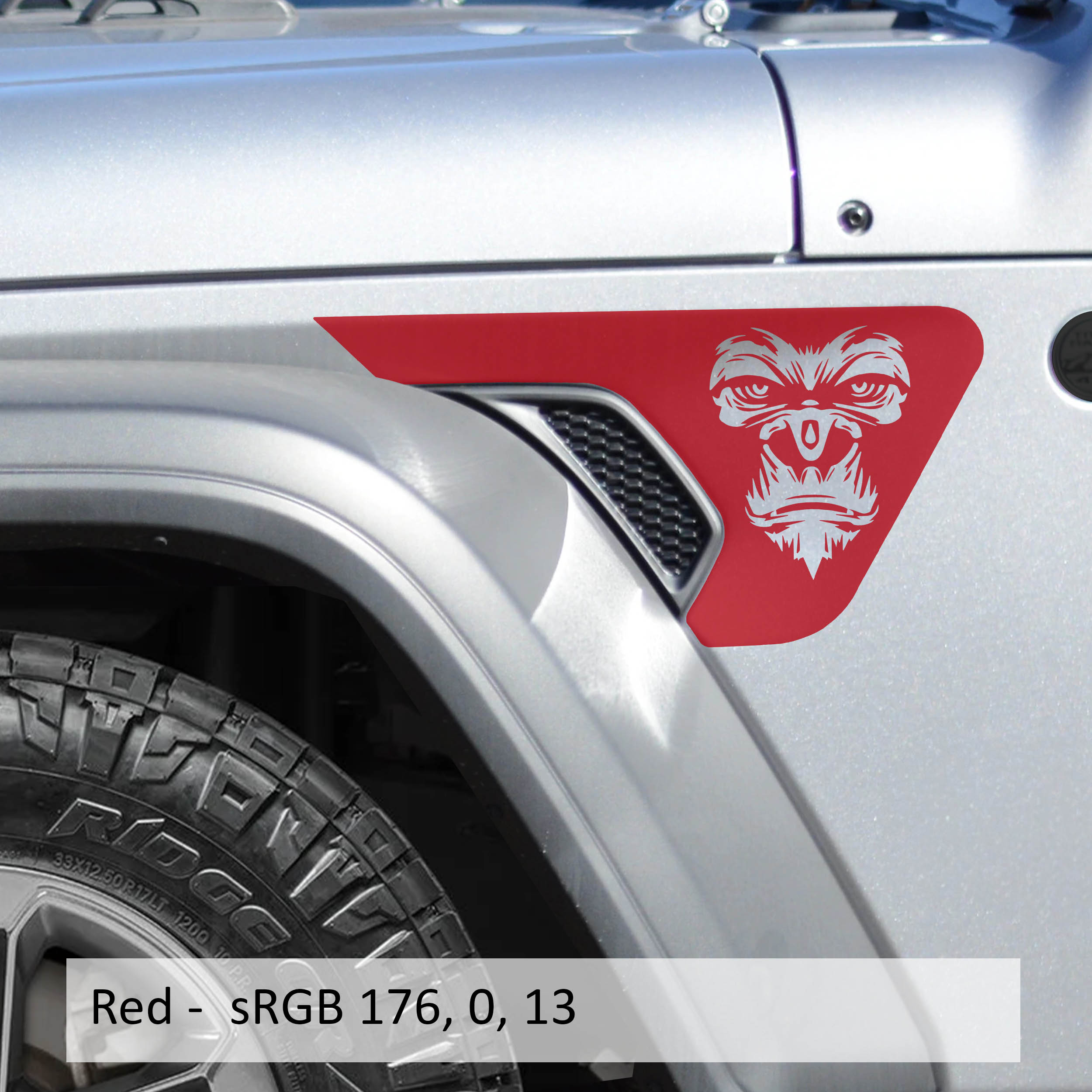 Red gorilla face billet fender vent decal pair installed on silver Jeep Wrangler JL fender