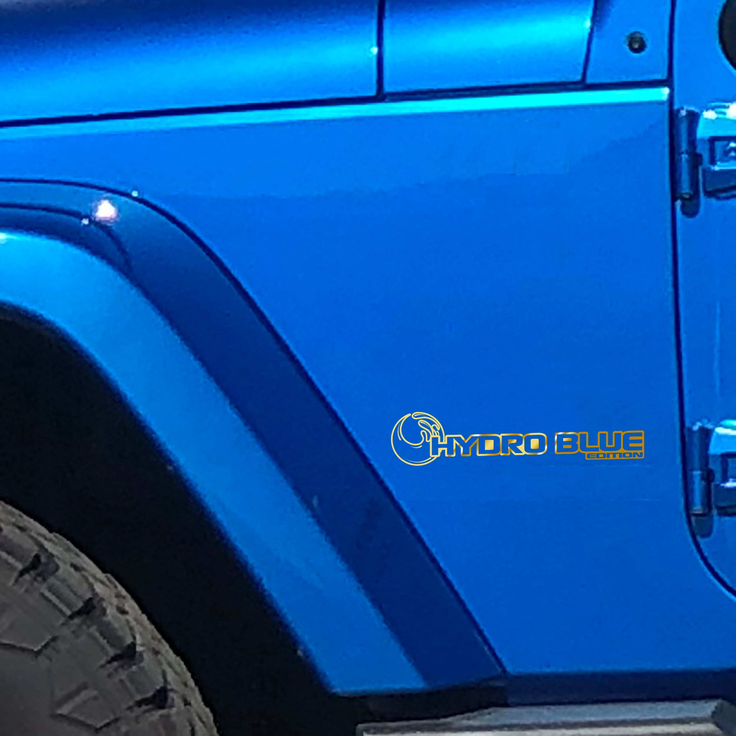 Gold Hydro Blue Edition wave fender decal pair installed on Jeep Wrangler JL Gladiator JT cowl