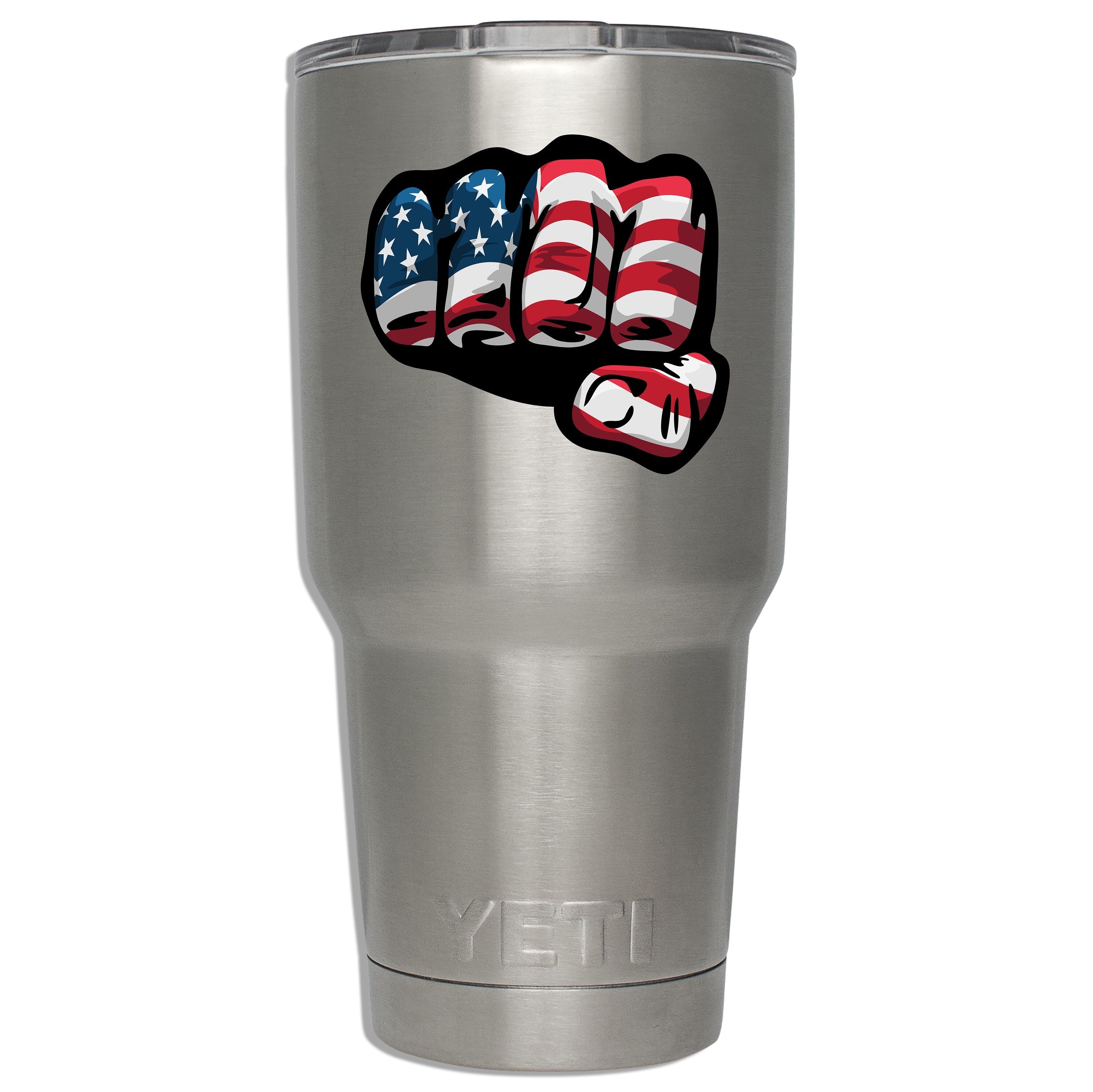 American flag fist decal mounted on a stainless YETI tumbler to display sticker dimensions on insulated steel