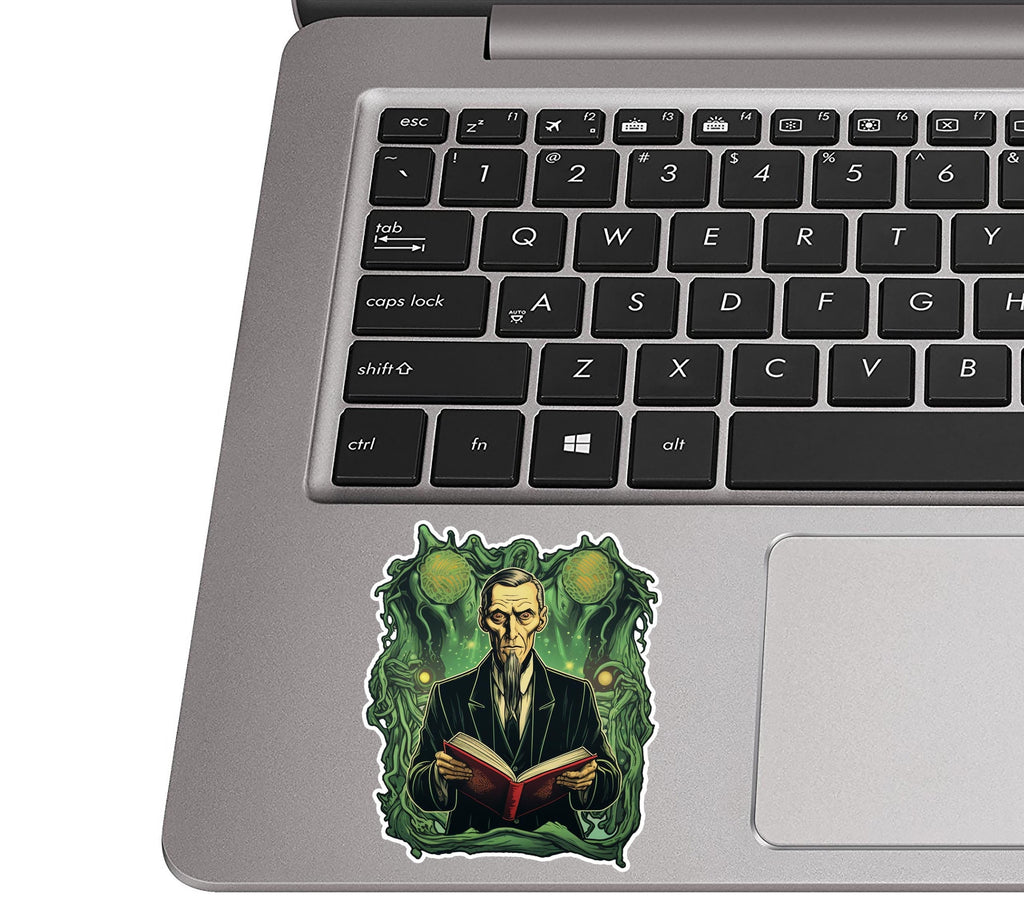 HP Lovecraft Call of Cthulhu sticker on silver laptop palm rest near black QWERTY keys for size scale view