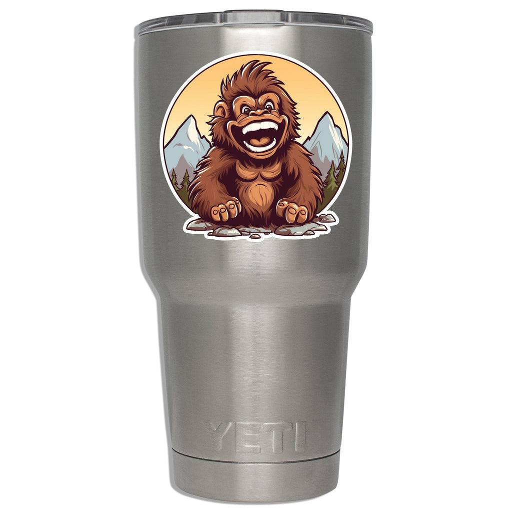 Baby sasquatch circle decal mounted on a stainless YETI tumbler showing size on insulated drinkware in scene