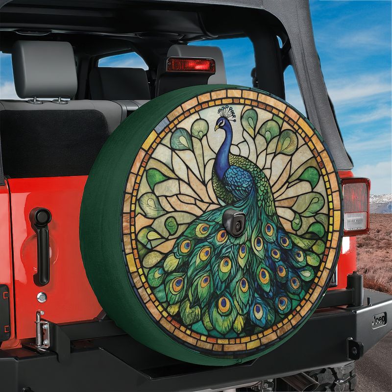 Stained glass peacock tire cover on red Jeep Wrangler with backup camera cutout vibrant feather art