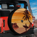 Sunset surfer spare tire cover on red Ford Bronco with palm tree silhouette and surfer holding board at dusk
