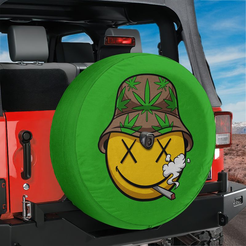 High Times spare tire cover with stoned cannabis smiley shown on red Jeep Wrangler tailgate