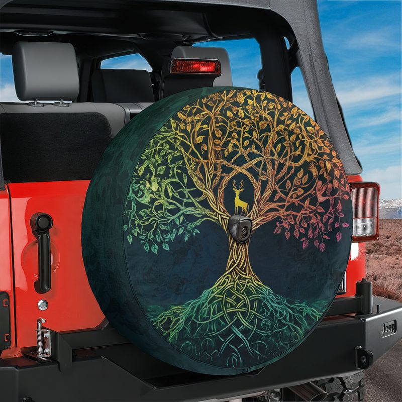Celtic dawn tree of life spare tire cover mounted on a red Ford Bronco tailgate in a desert canyon backdrop